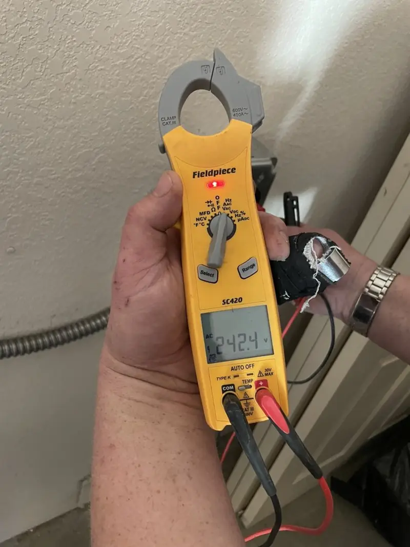 Voltage testing with clamp meter during Electrical Installation Services in Palos Hills
